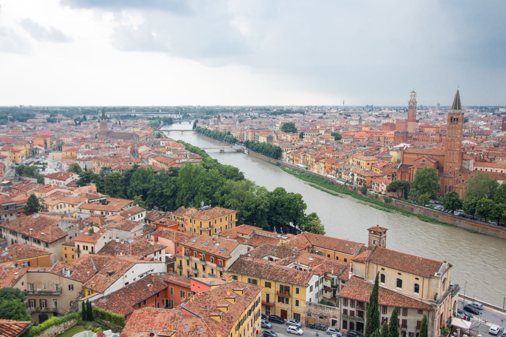 italian-city-views-across-a-river-and-orange-rooftops-viewpoint-from-castel-san-pietro