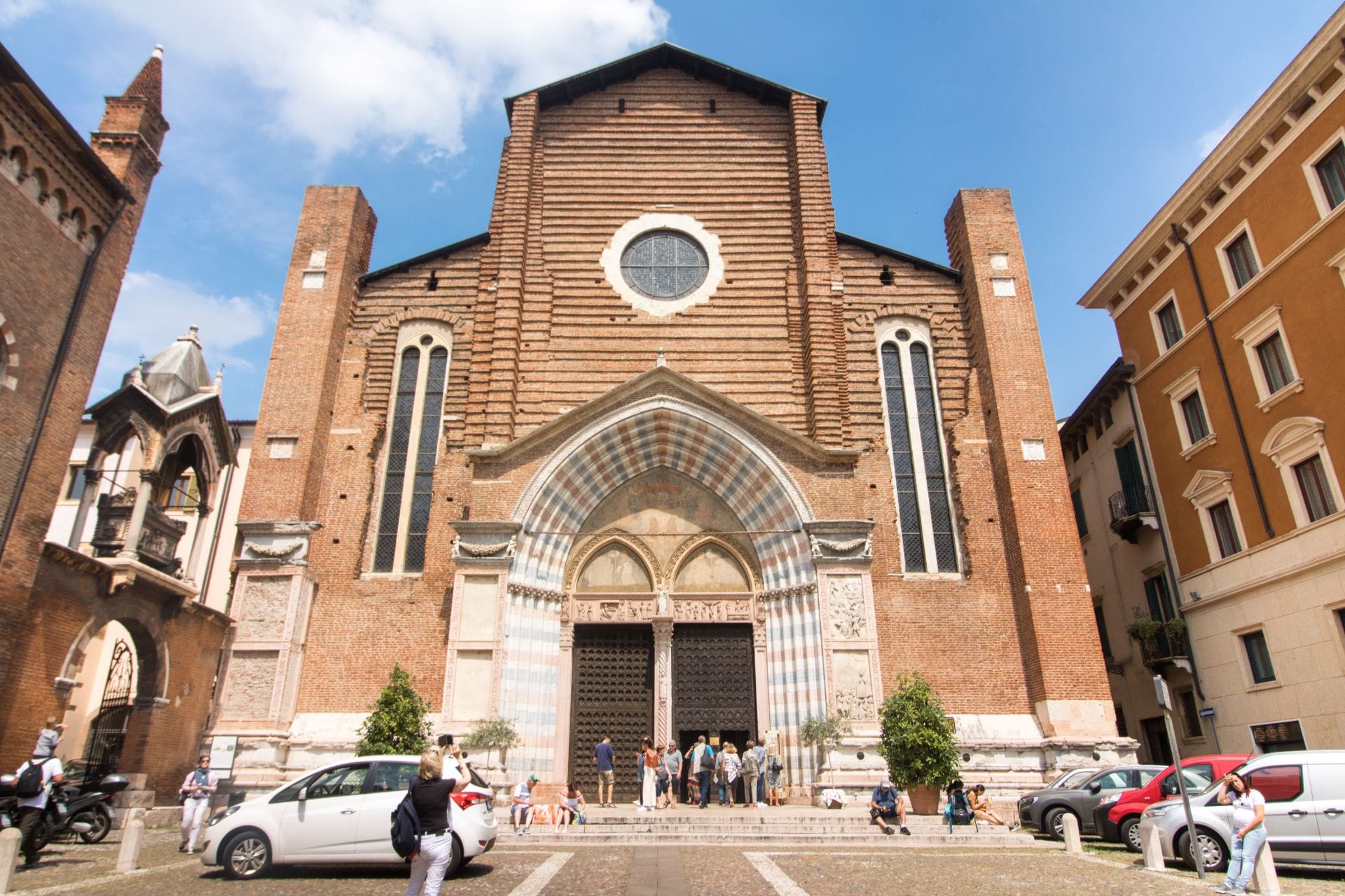 people-standing-outside-a-beautiful-and-historic-italian-church-during-summer-chiesa-di-santa-anastasia