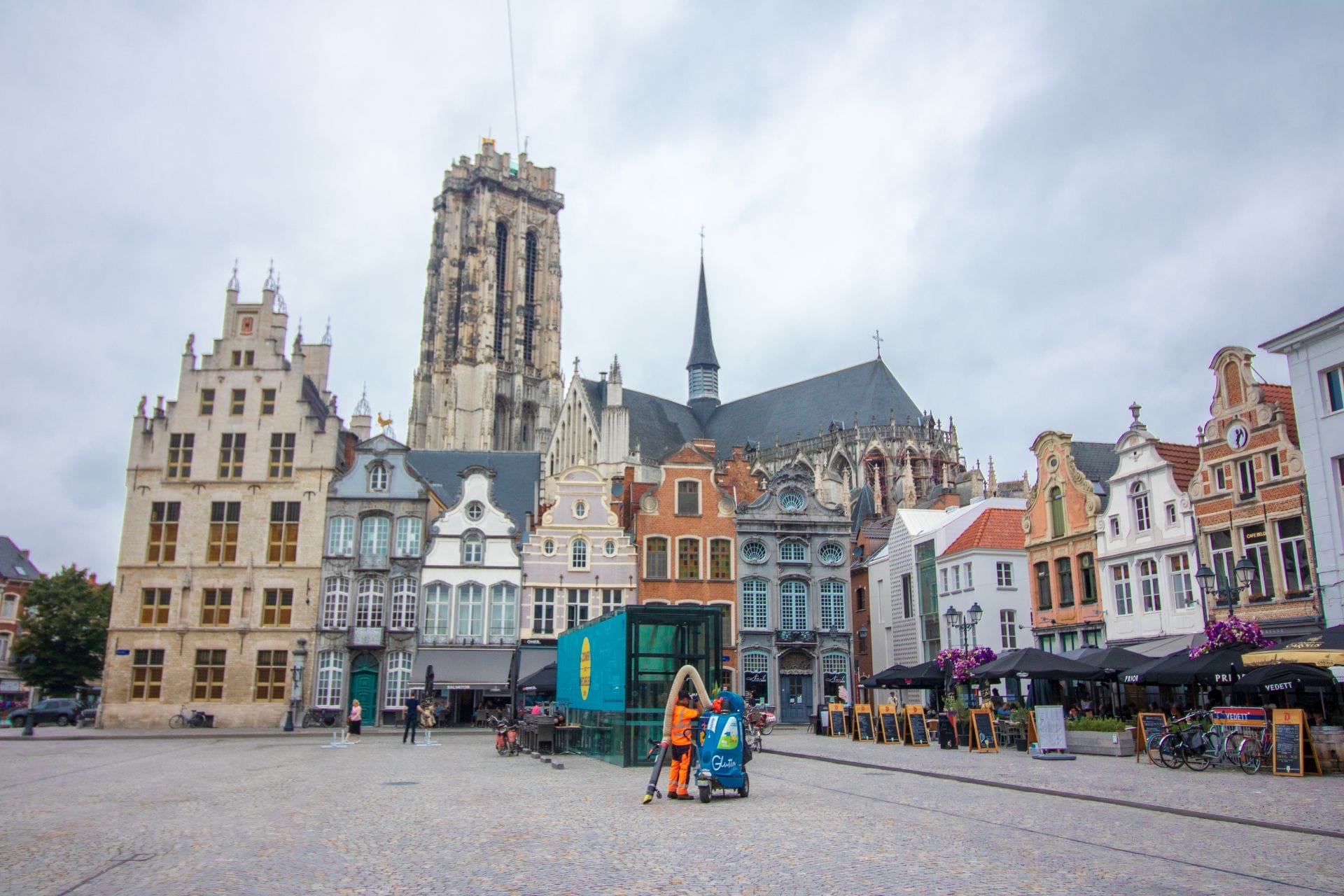 pretty-european-central-square-with-a-cathedral-colourful-buildings-and-outdoor-restaurants-grote-markt-things-to-do-in-mechelen-belgium