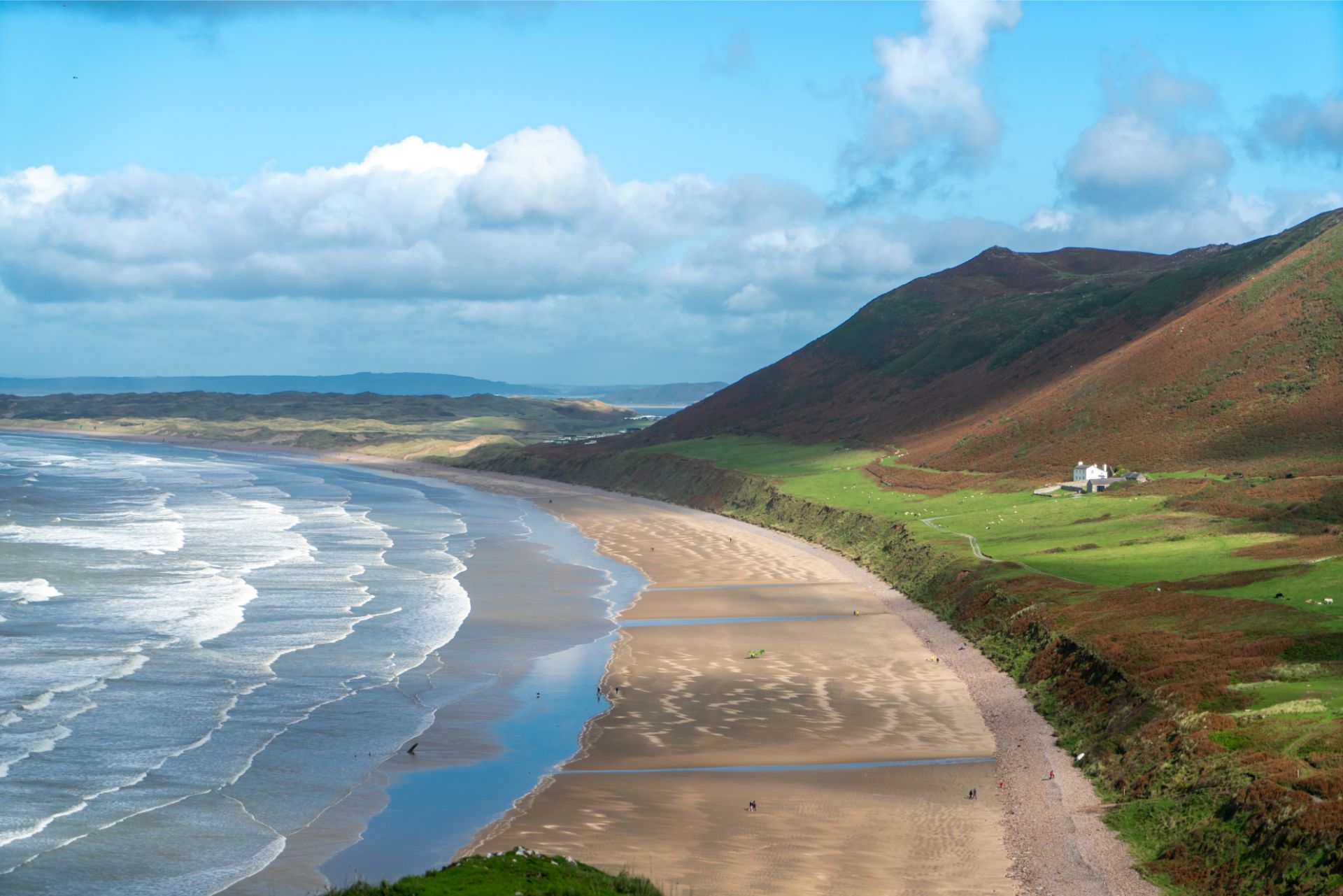 light-hitting-the-coast-sea-and-beach-at-rhossili-bay-weekend-in-the-gower-swansea-bay-wales