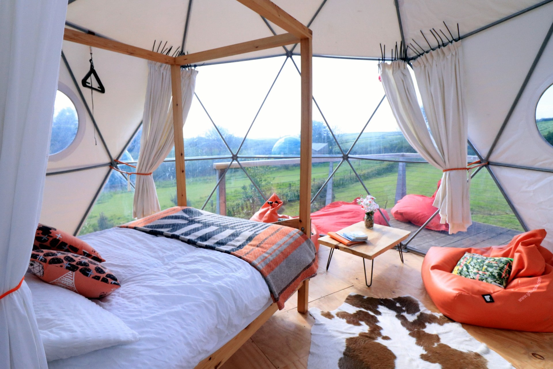 inside-a-quirky-geodome-glamping-site-in-a-field-with-a-four-poster-bed-loveland-farm-devon-unusual-romantic-weekend-breaks-uk