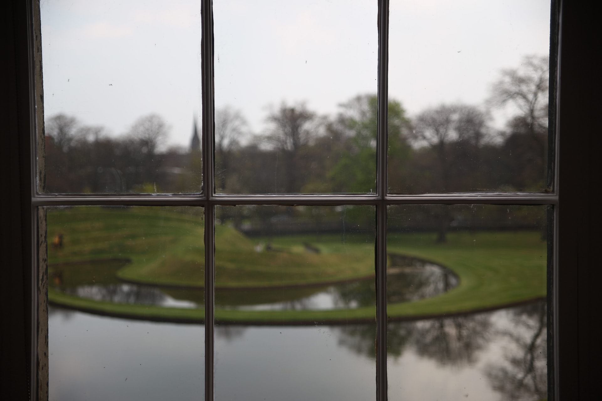 old-window-on-a-dark-winter-day-looking-out-to-garden-at-the-scottish-national-gallery