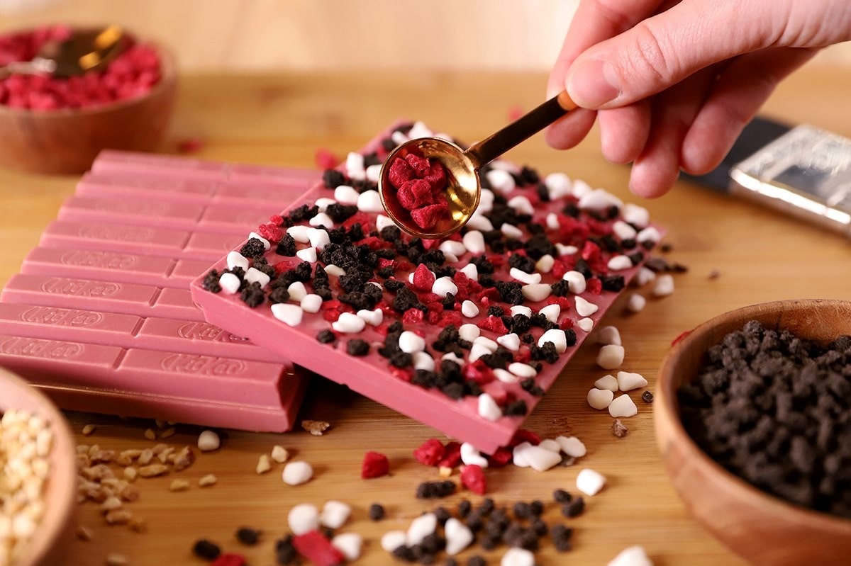 hand-making-special-pink-chocolate-bar-at-york-chocolate-story-romantic-things-to-do-in-york-for-couples