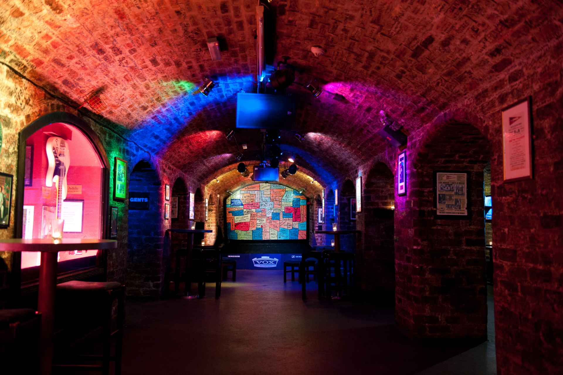 inside-of-the-cavern-club-stage-lit-up-in-neon-lights