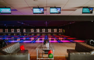 bowling-alley-lit-up-in-dark-with-sofas-nottingham-bowl-date-ideas-nottingham