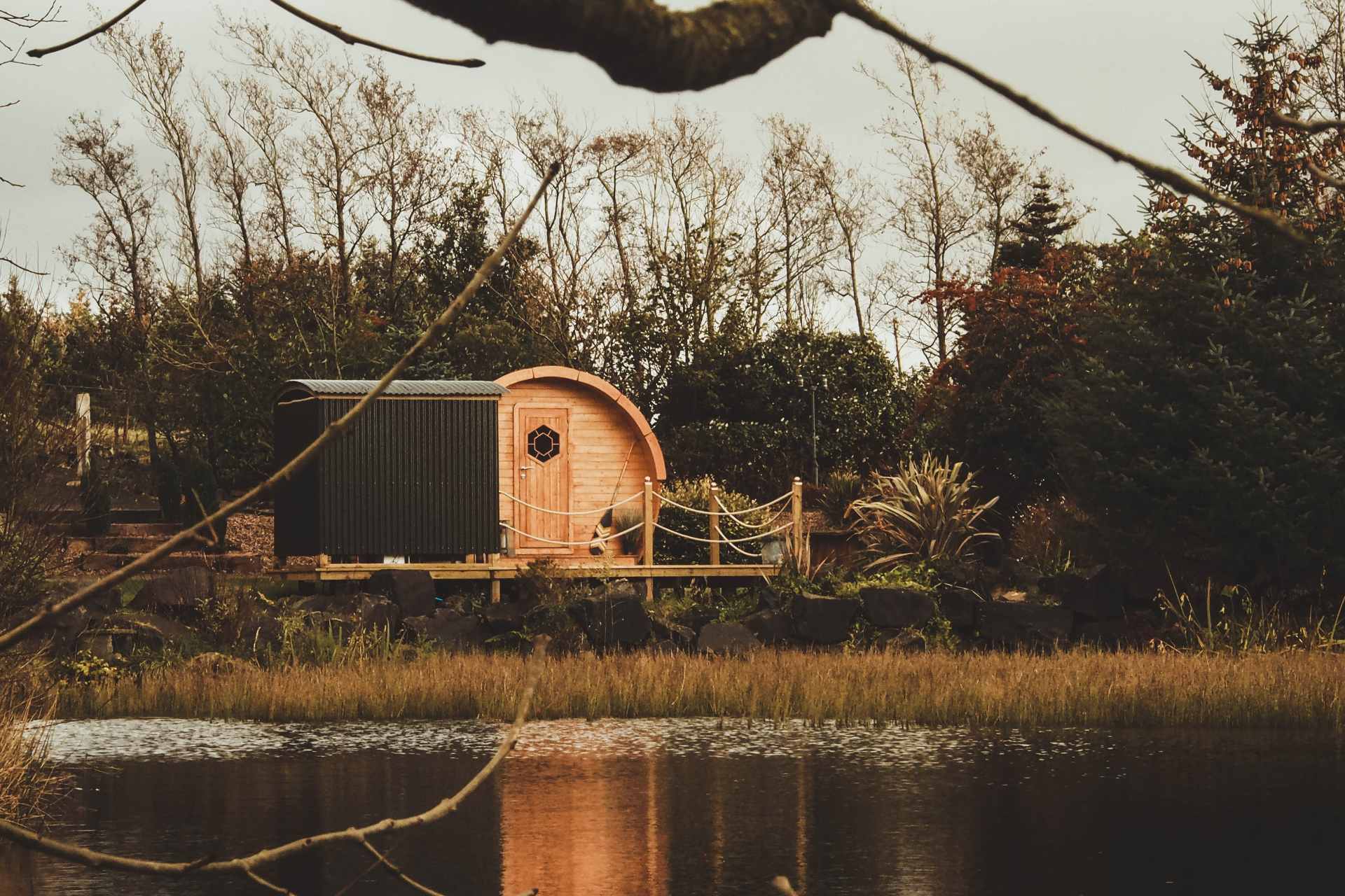 circular-pod-on-decking-by-lake-pod-on-the-pond-glamping-northern-ireland