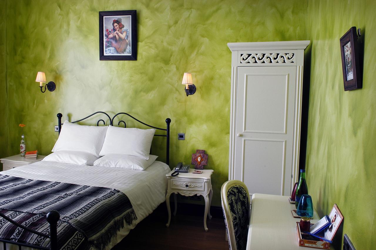 rustic-bedroom-with-green-walls-church-street-hotel