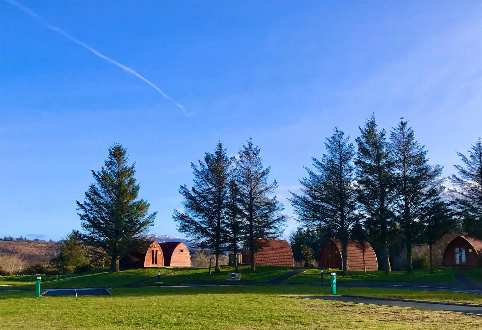 wild-atlantic-camp-pods-amid-trees-on-sunny-days-glamping-donegal