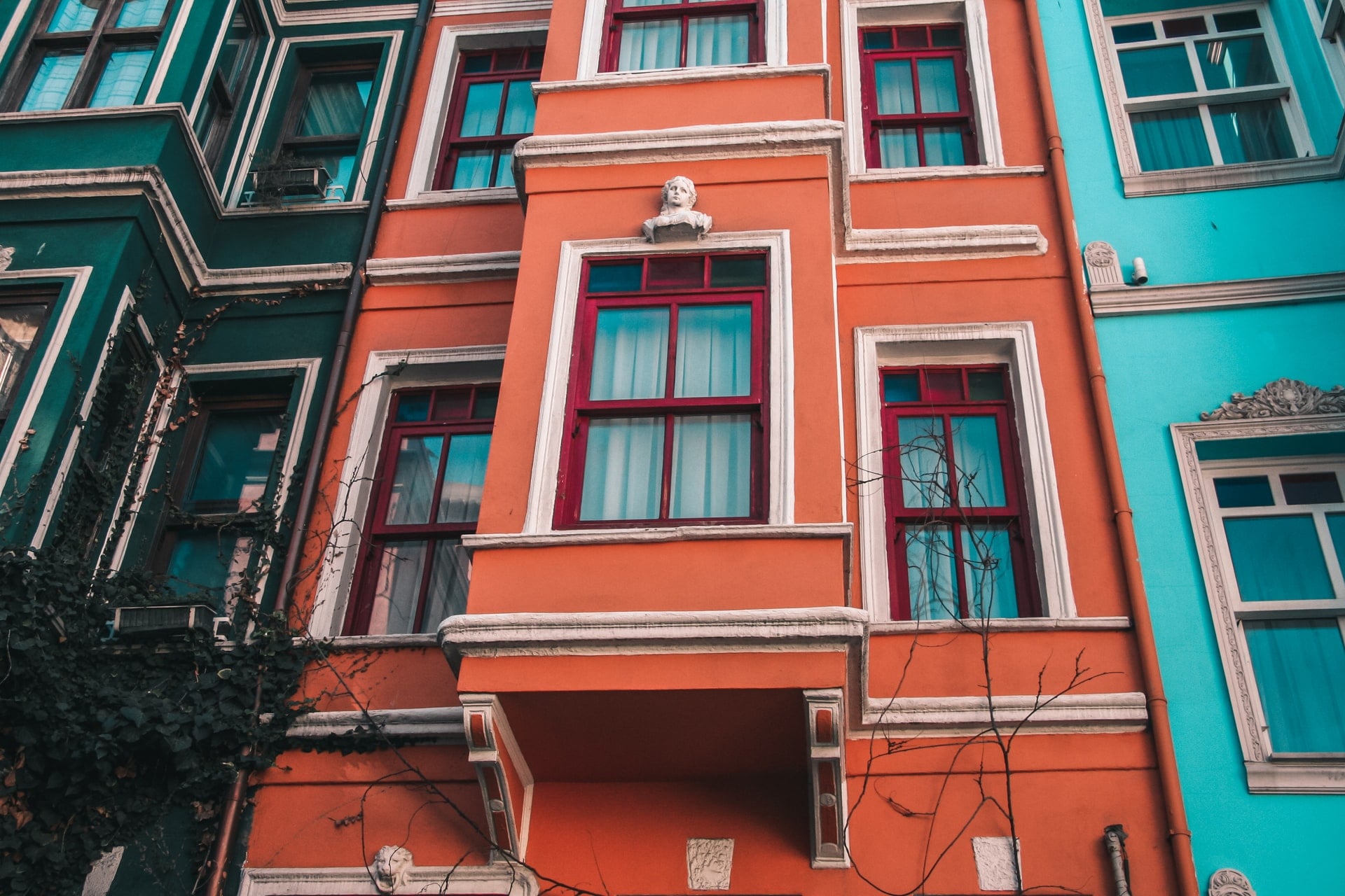 colourful-coral-and-teal-buildings-down-street-in-balat