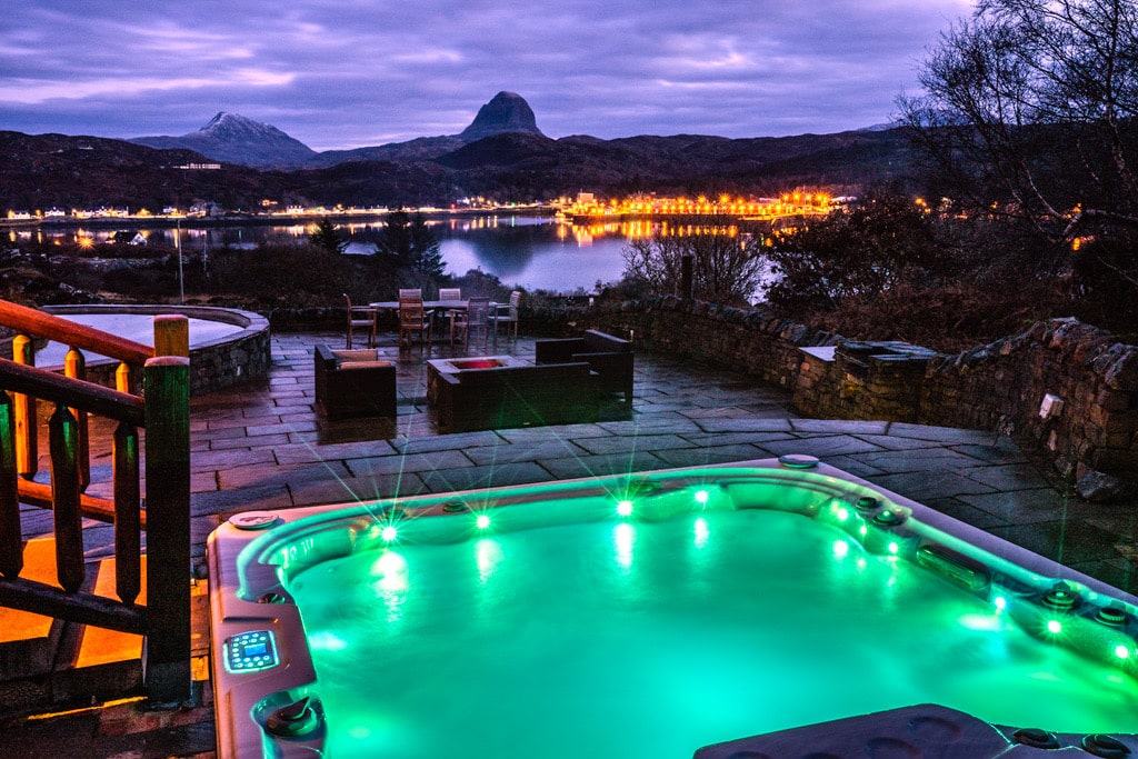 hot-tub-on-waterloo-lodge-patio-at-night-overlooking-lake