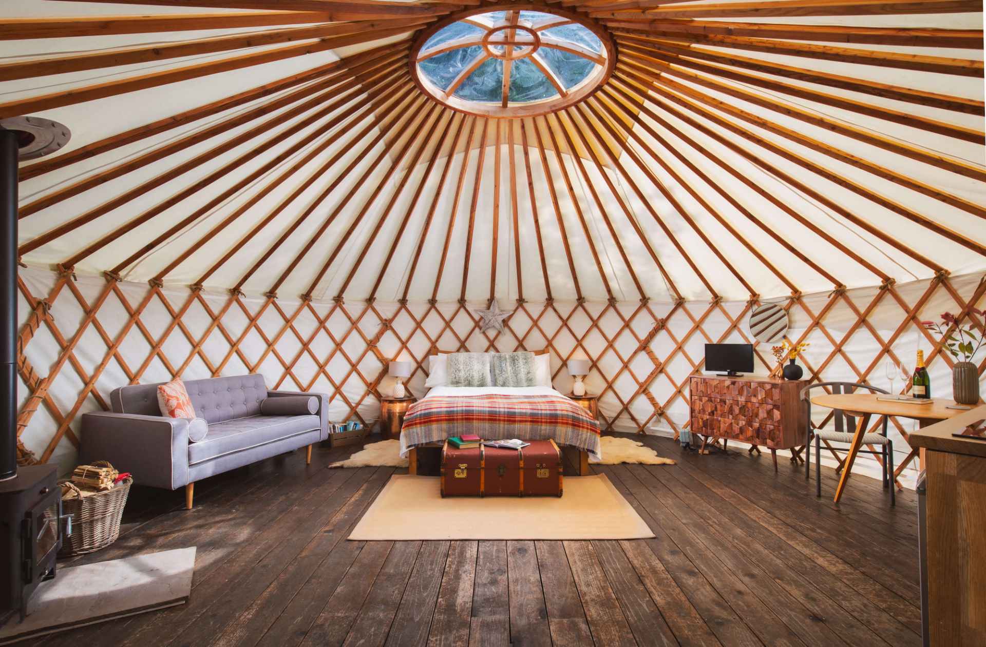large-bedroom-and-living-area-inside-larch-yurt-at-the-yurt-retreat-glamping-somerset-somerset-glamping