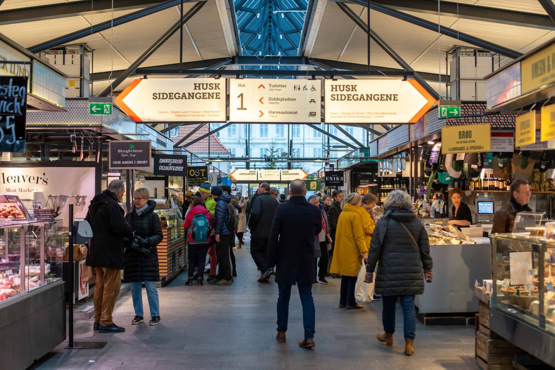 people-walking-around-torvehallerne-market-hall-food-stalls