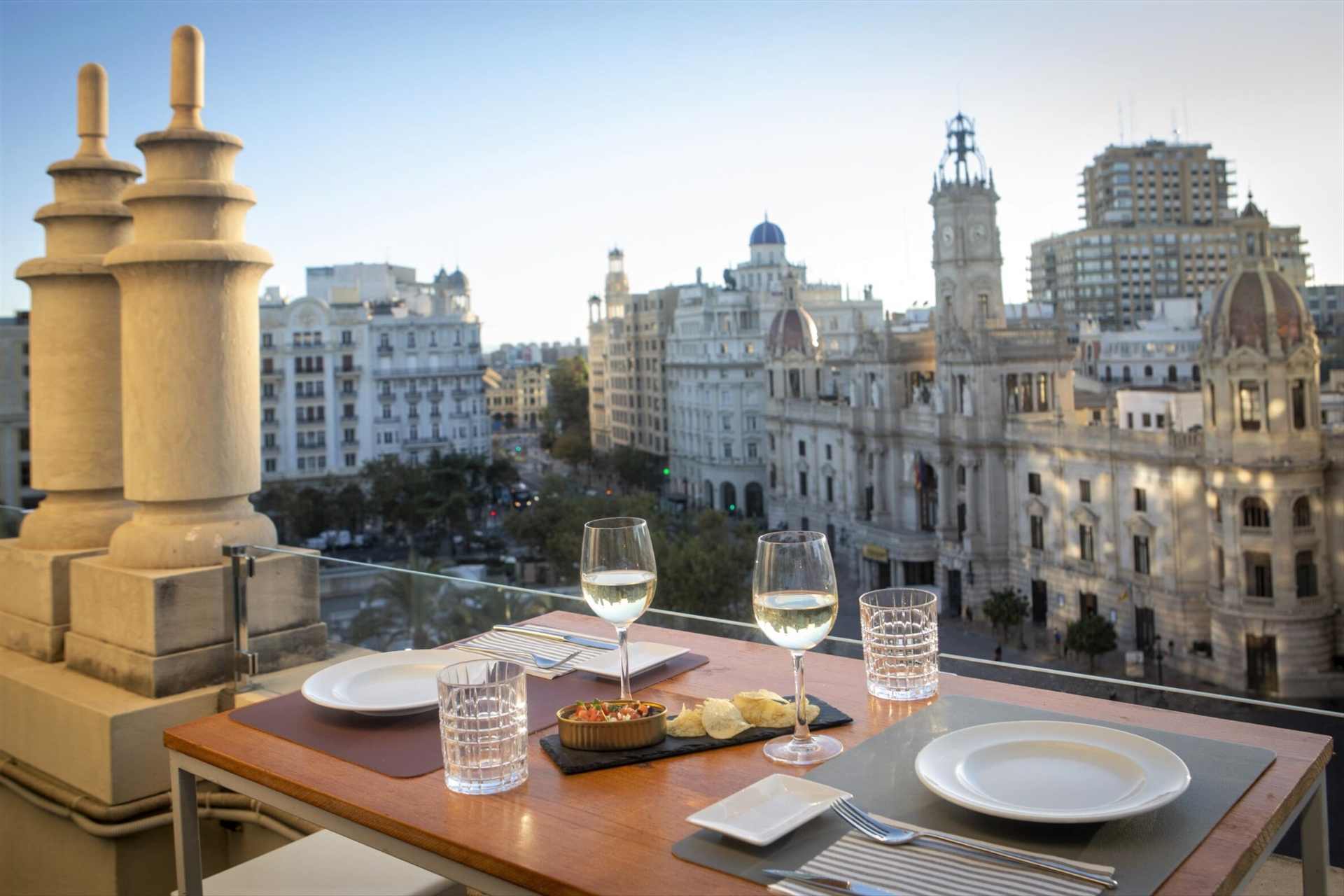 two-glasses-of-white-wine-on-rooftop-bar-overlooking-square-2-days-in-valencia-itinerary