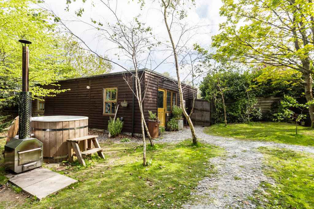 brown-pip-and-pips-cabin-in-garden-with-hot-tub