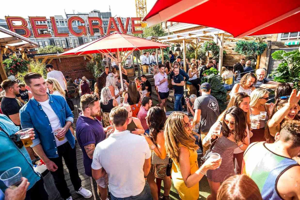 crowds-of-people-drinking-on-rooftop-of-belgrave-music-hall-and-canteen-rooftop-bars-leeds