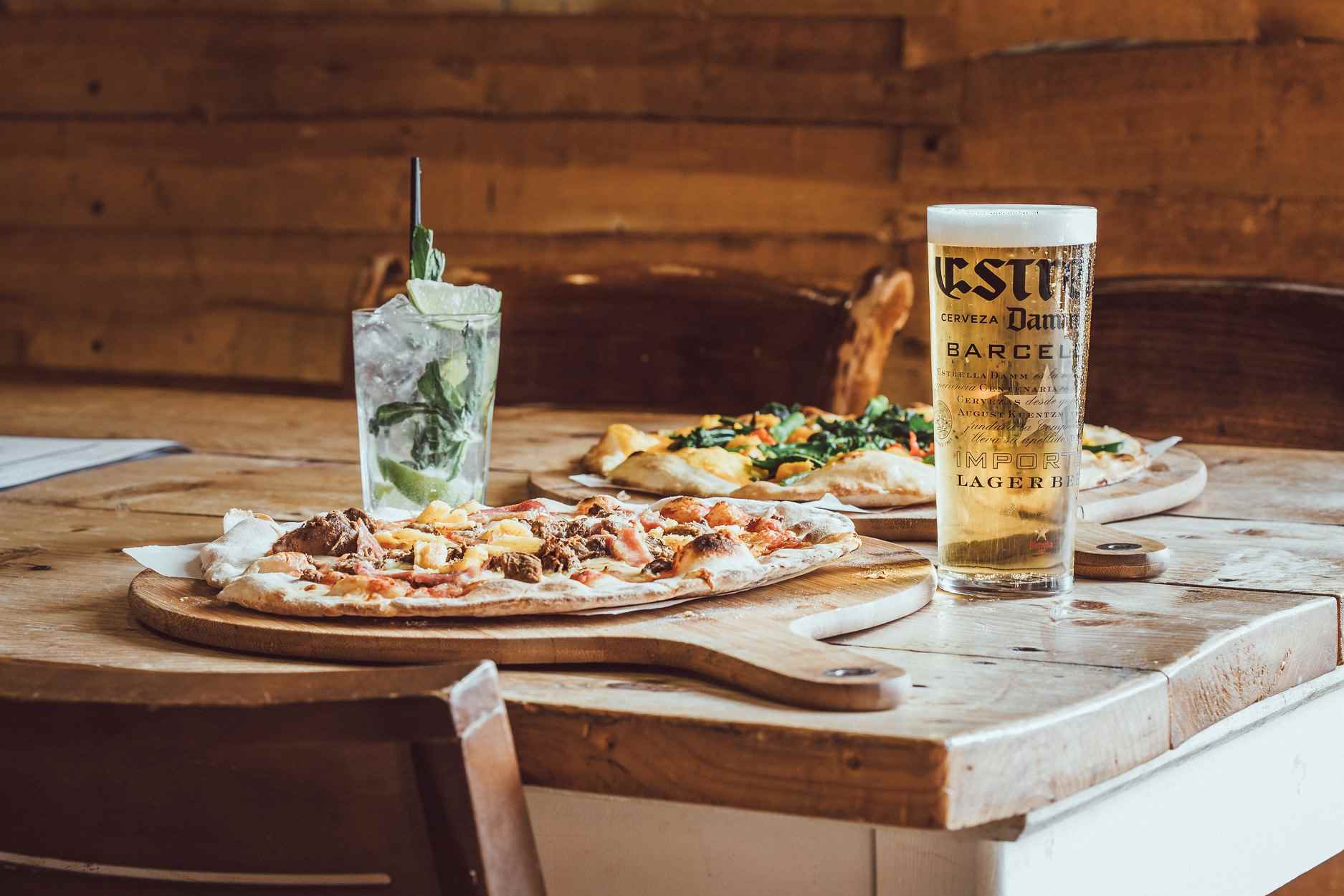 pizza-beer-and-cocktails-on-table-at-craft-and-dough-bottomless-brunch-sheffield