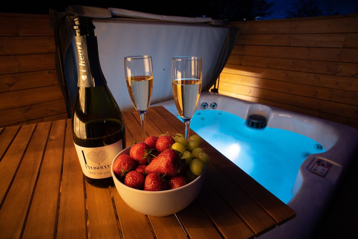 prosecco-strawberries-and-grapes-by-hot-tub-at-night-at-the-secret-garden-lodge
