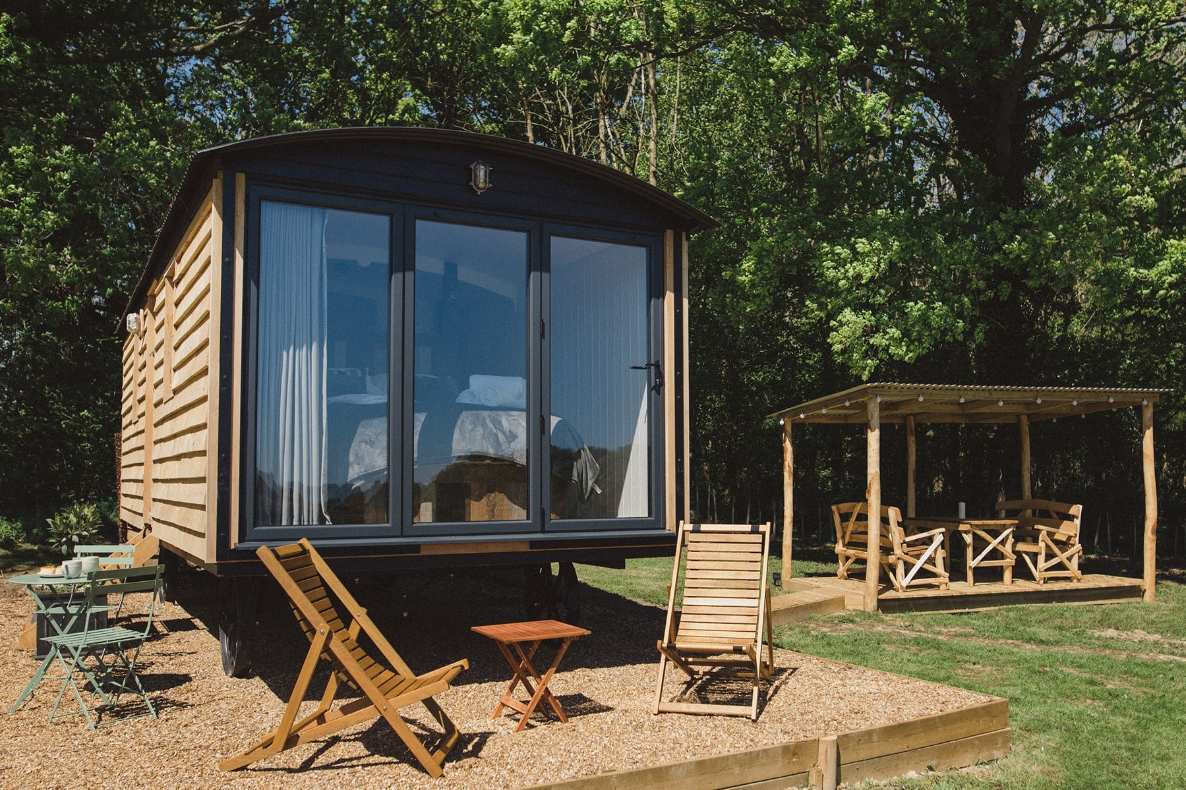the-long-view-shepherds-hut-in-field-at-swallowtail-hill-glamping-sussex