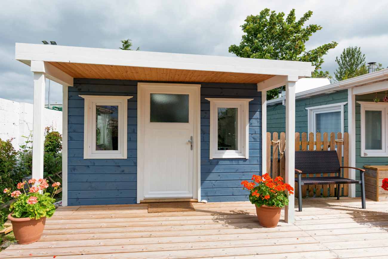 blue-off-grid-cabin-on-sheltered-decking-glamping-galway