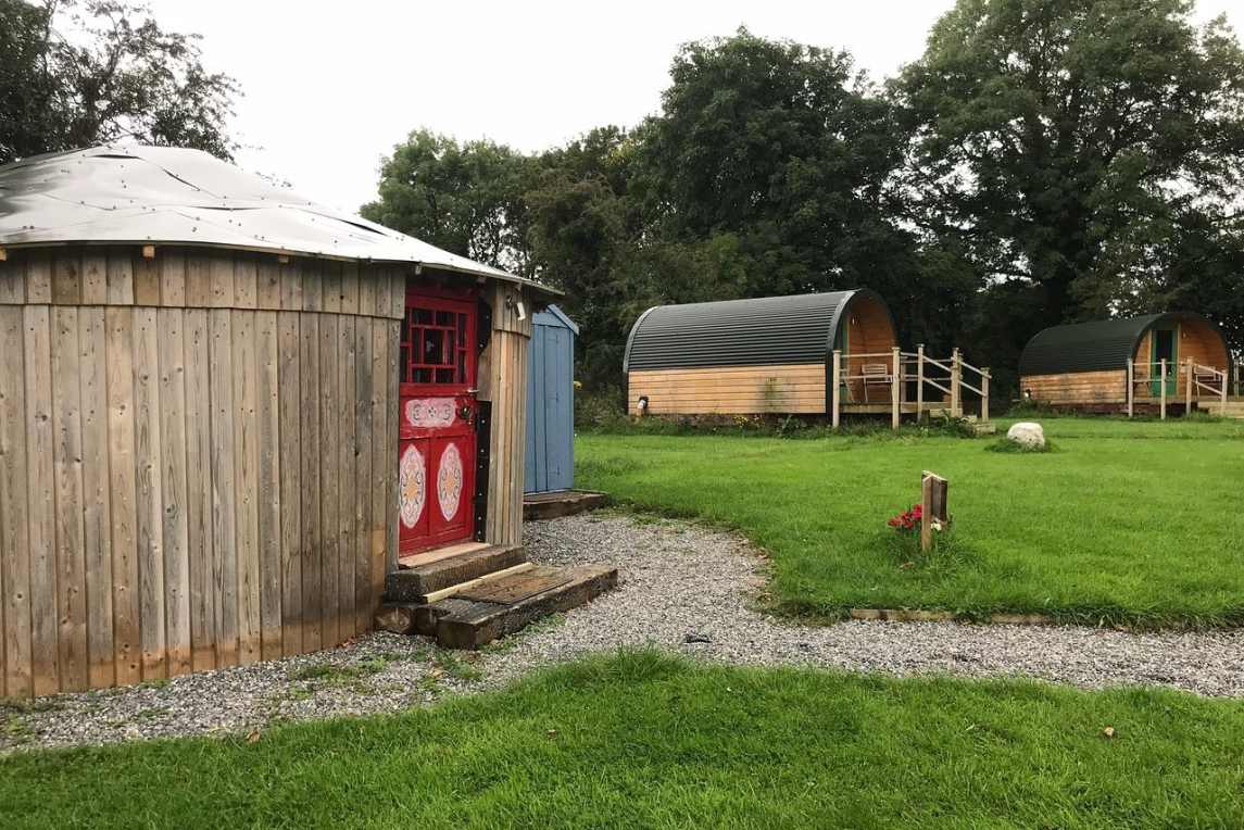 carrigeen-glamping-yurt-with-red-door-in-field