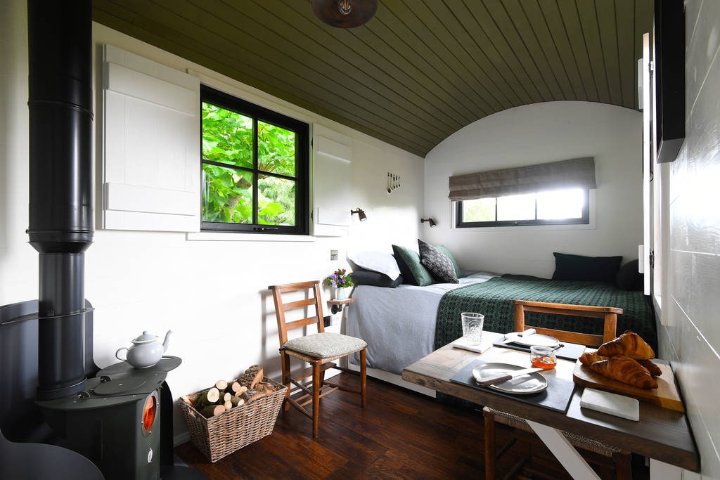 interior-of-bugail-hut-at-hide-at-st-donats-with-bed-and-living-area-glamping-south-wales