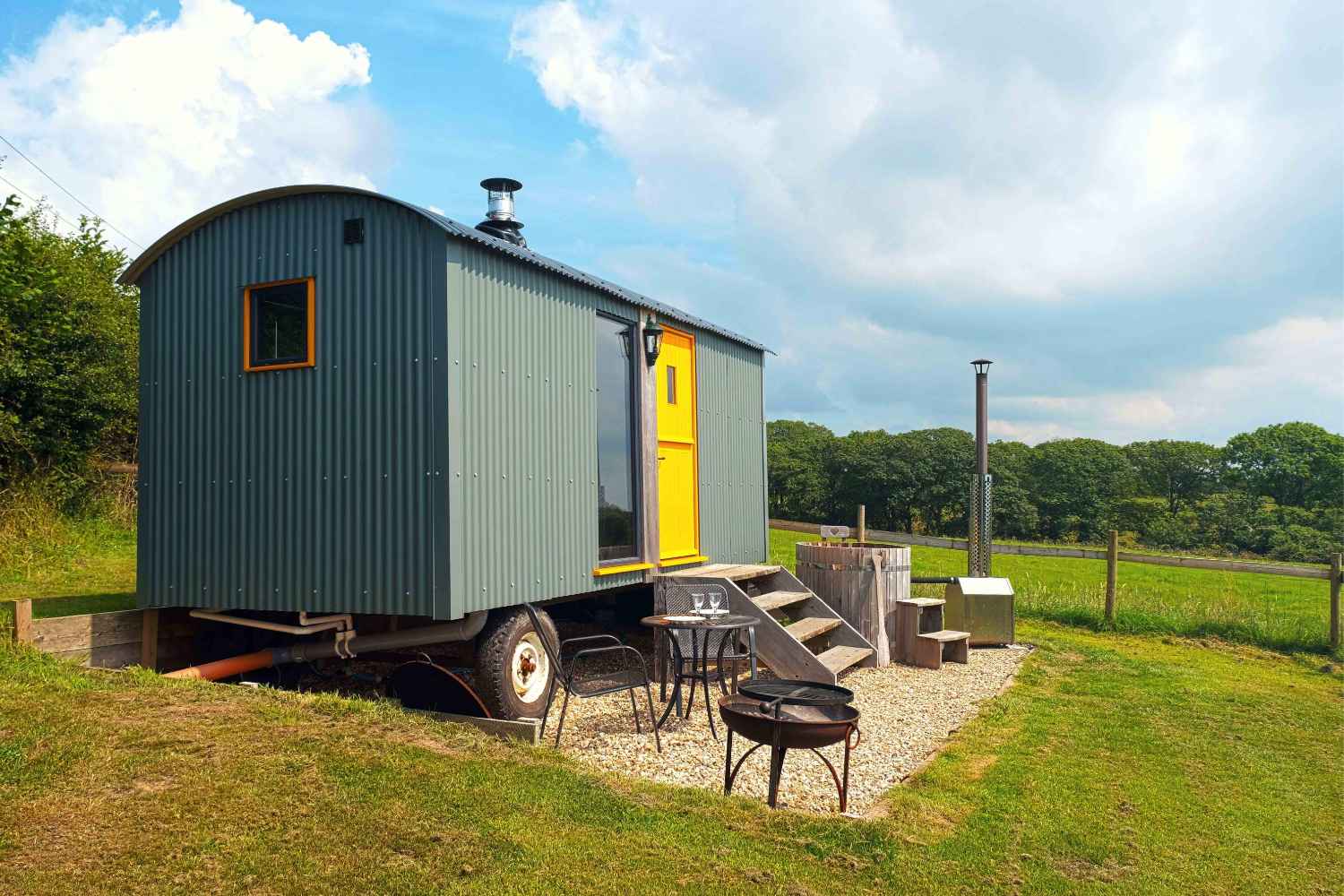 mint-big-cwtch-shepherds-hut-with-yellow-door-in-field-glamping-south-wales