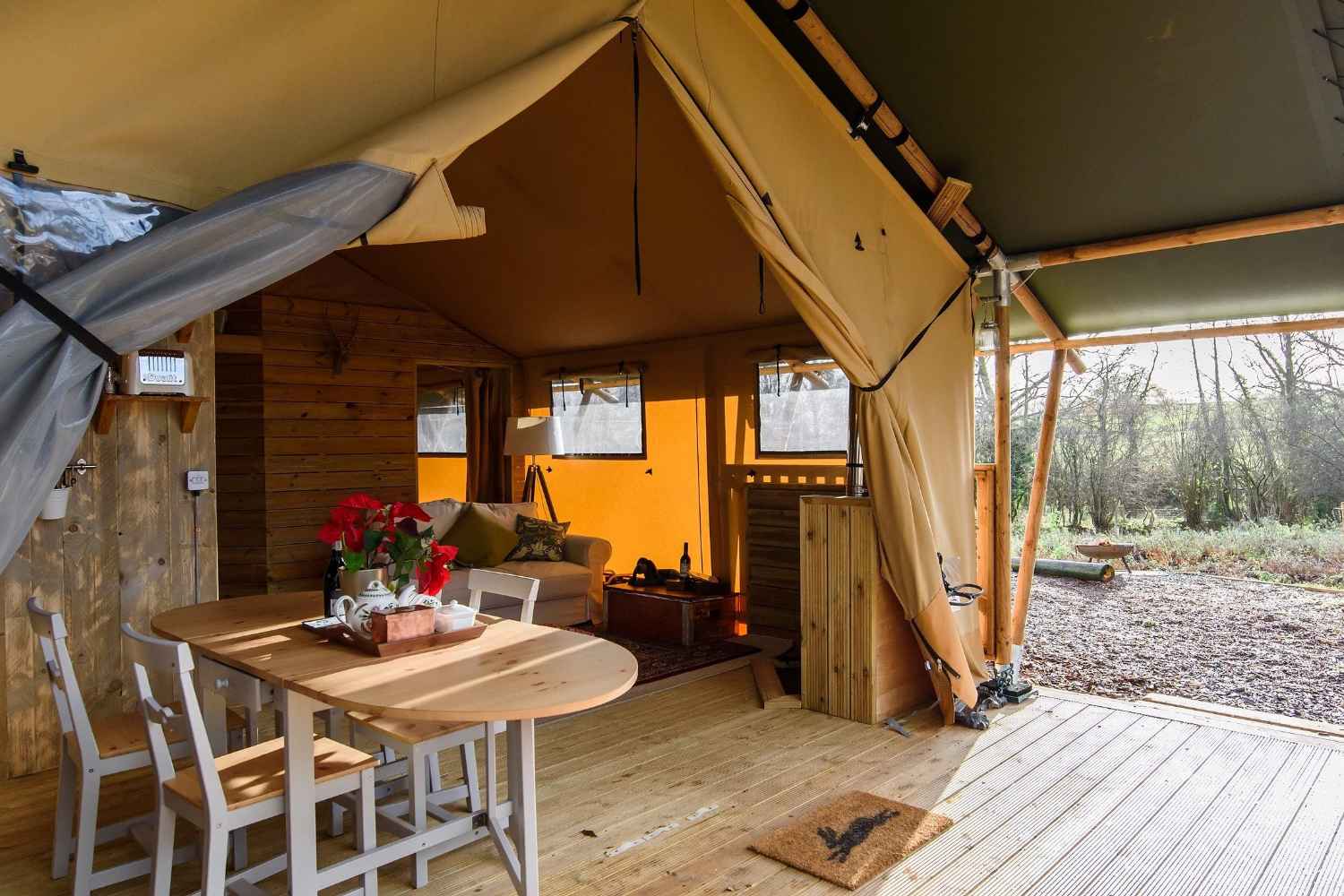 table-on-decking-of-medley-meadow-safari-tent