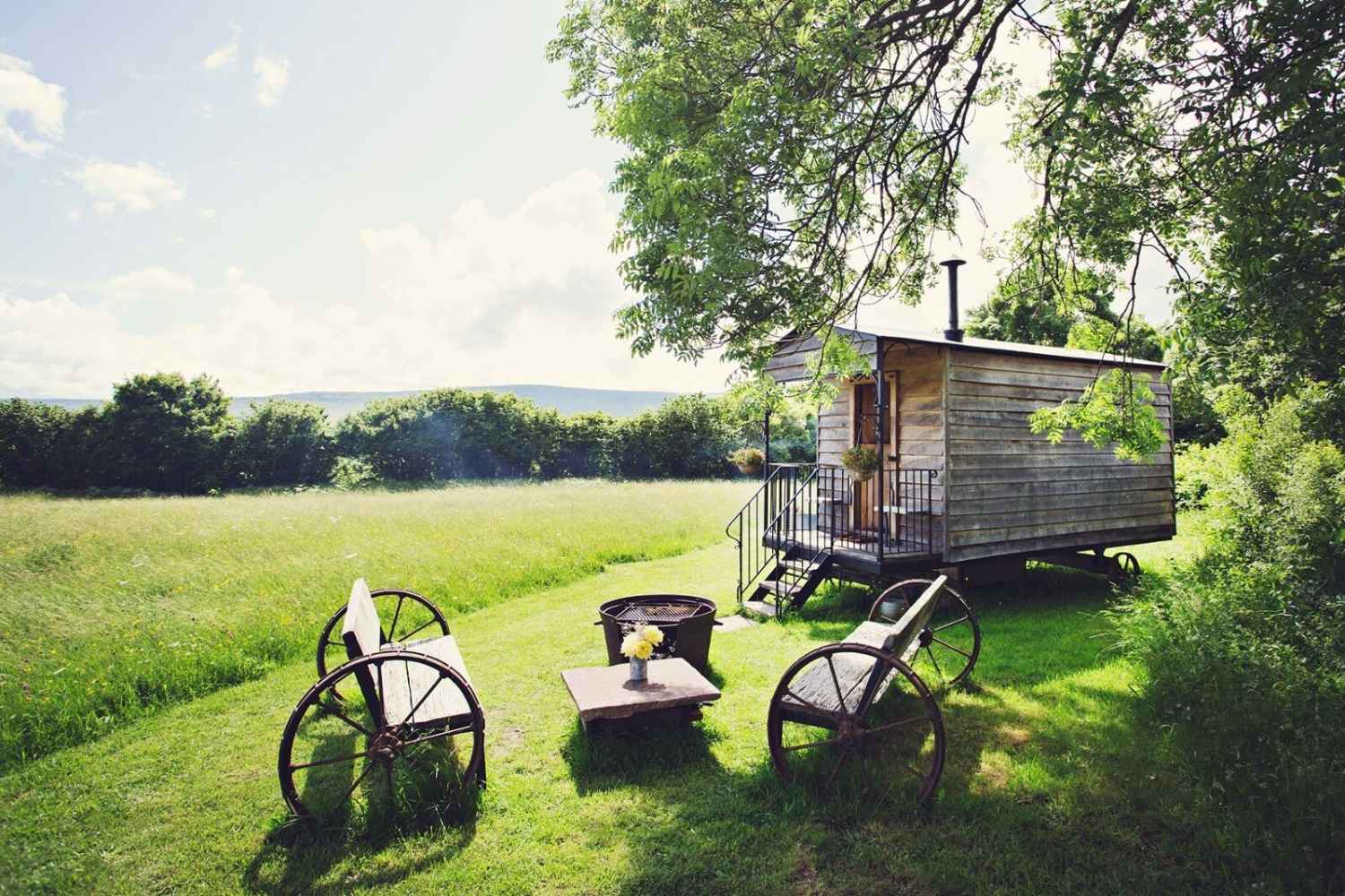 the-hot-tub-hideaway-shepherds-hut-with-outdoor-seating-area-in-field-glamping-south-wales