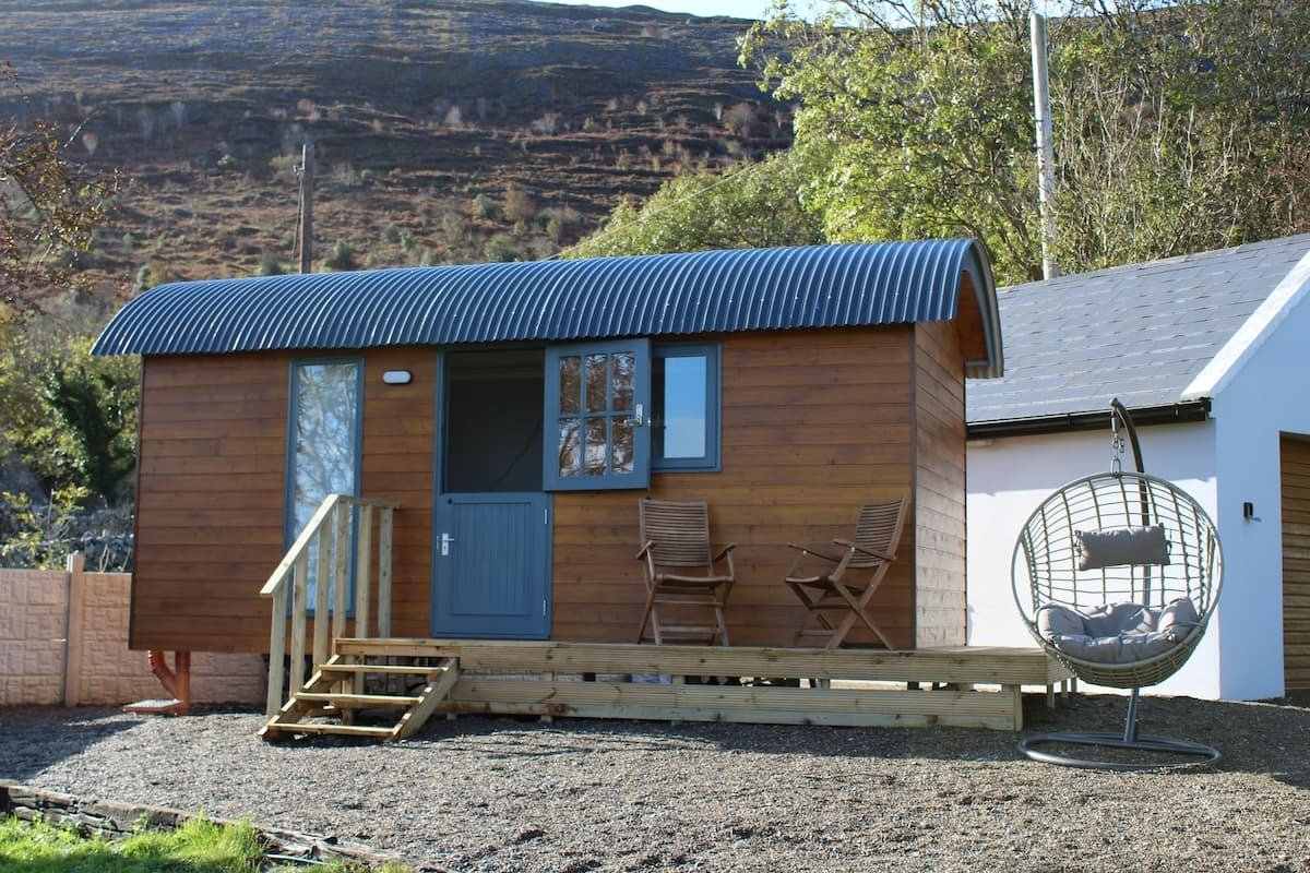 brown-and-blue-atlantic-haven-shepherds-hut-with-outdoor-seating