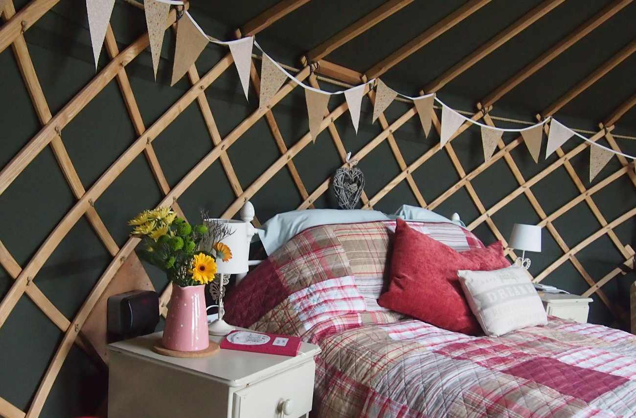 double-bed-and-bunting-inside-cheshire-farm-yurt