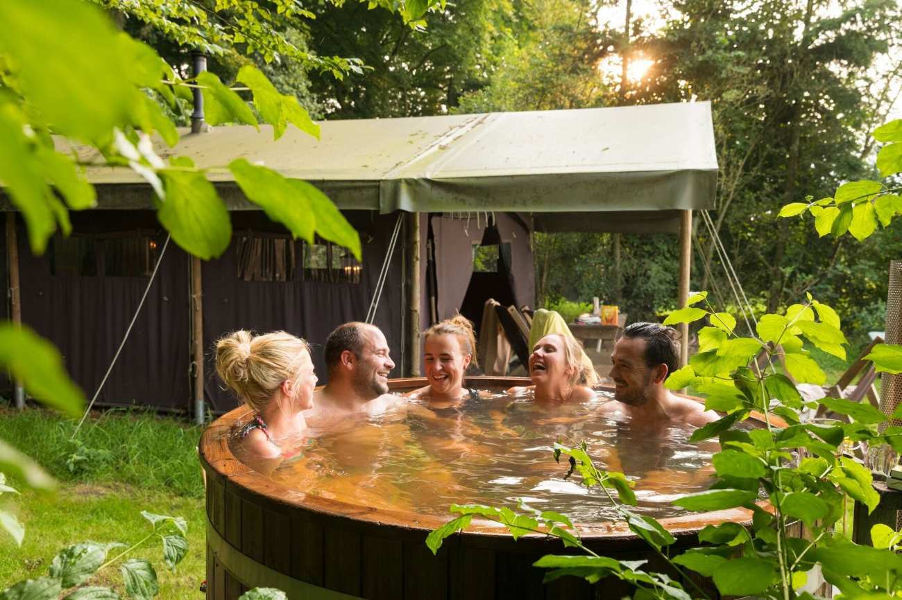 group-of-friends-in-hot-tub-at-wyresdale-park-safari-tents
