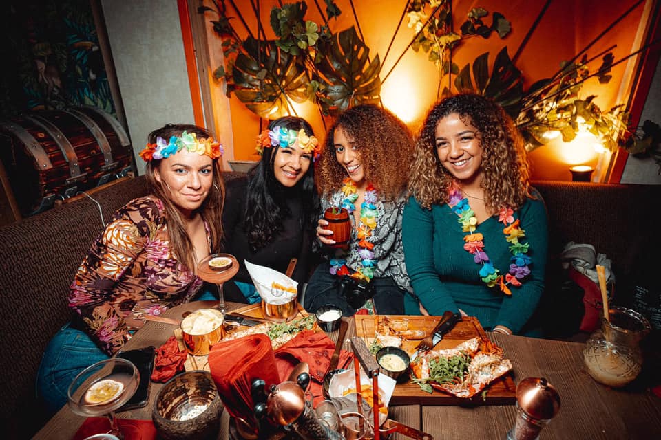 group-of-women-eating-and-drinking-at-tropix-bar-bottomless-brunch-clapham