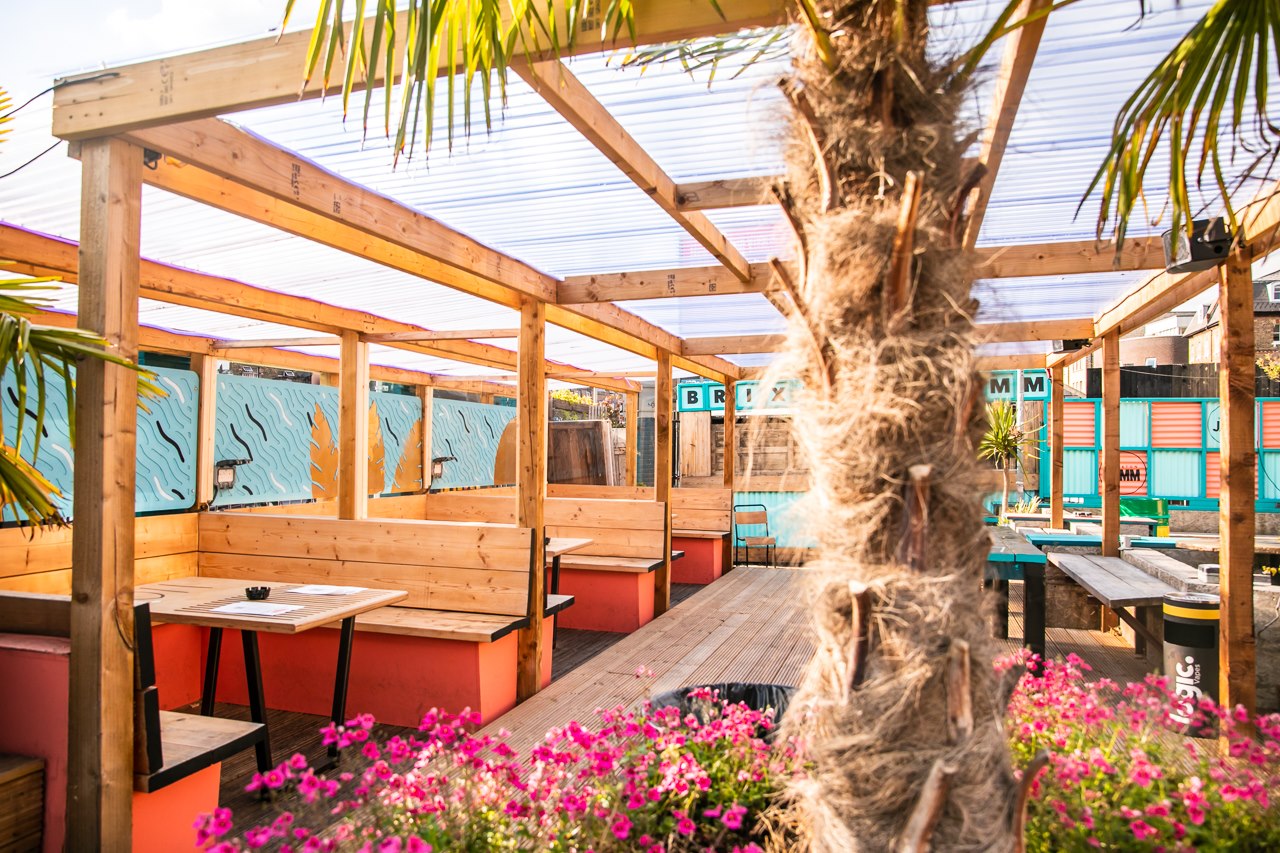 palm-trees-and-outdoor-tables-at-brixton-courtyard-bottomless-brunch-brixton