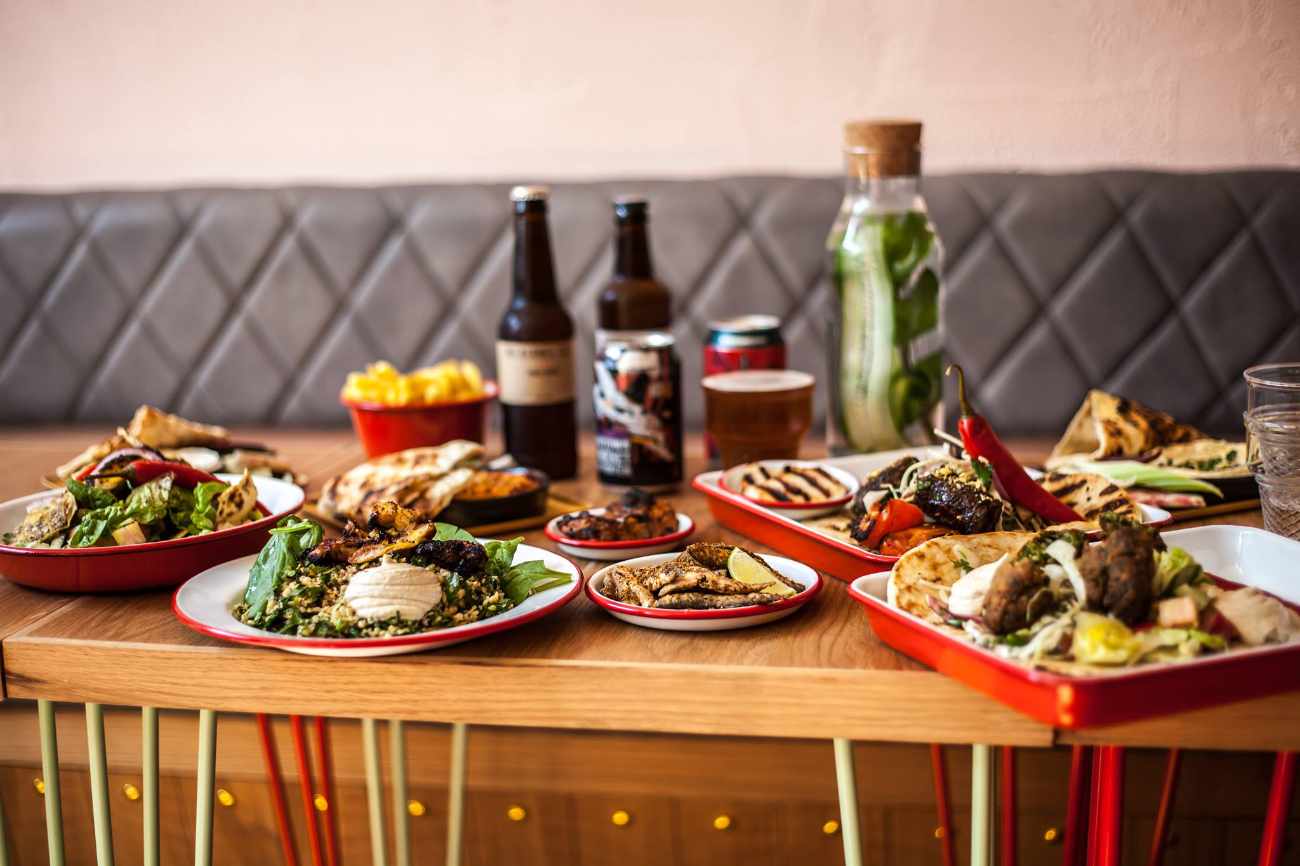plates-of-food-and-drinks-on-restaurant-table-at-bababoom