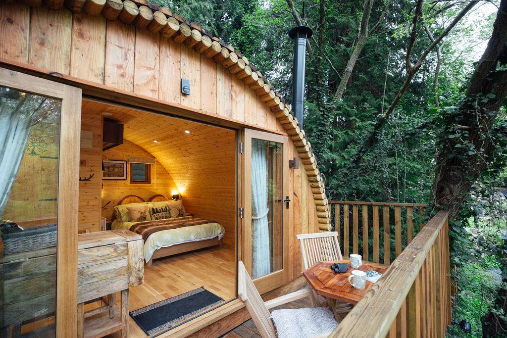bedroom-and-decking-of-squirrels-nest-treehouse-glamping-gloucestershire
