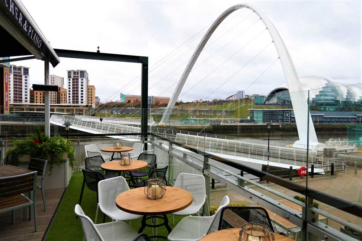 pitcher-and-piano-roof-terrace-overlooking-river-and-bridge