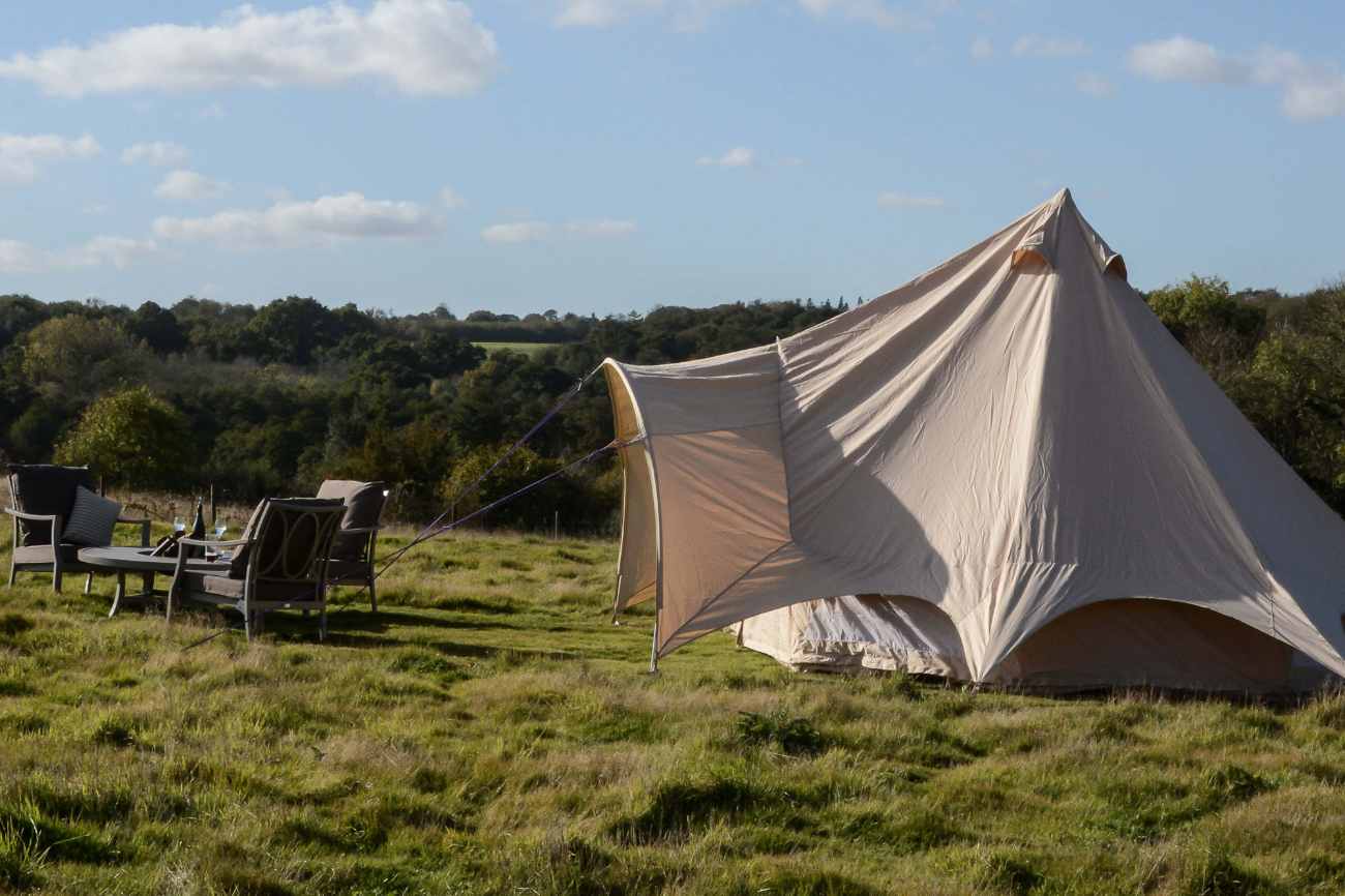 white-chegworth-mill-glamping-tent-in-field