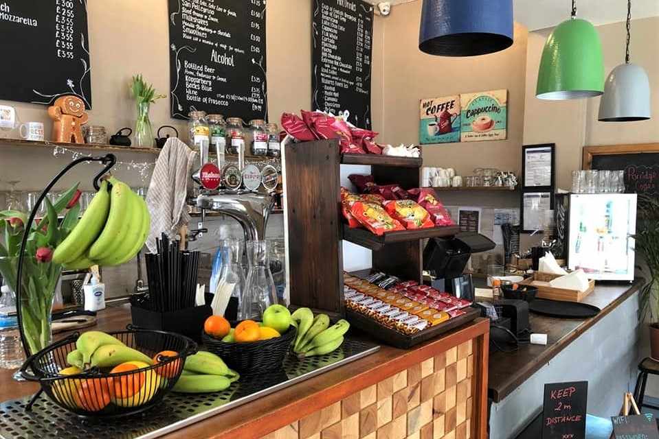 counter-of-caffee-oro-cafe-with-fruit-chocolate-and-crisps