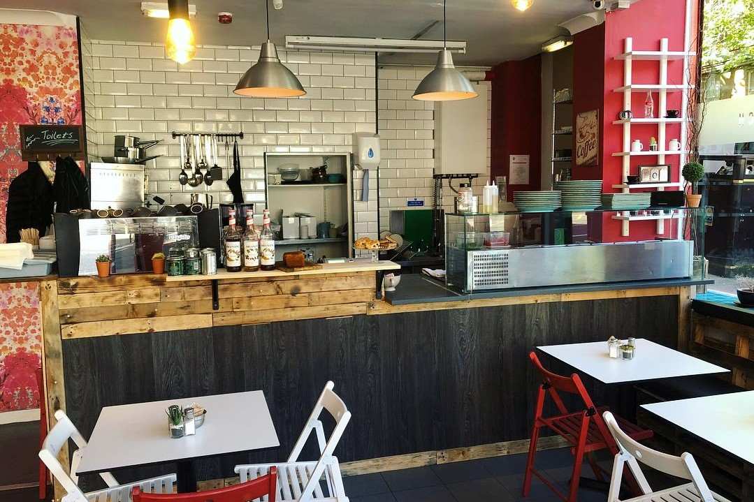 interior-of-urban-west-cafe-with-counter-and-tables