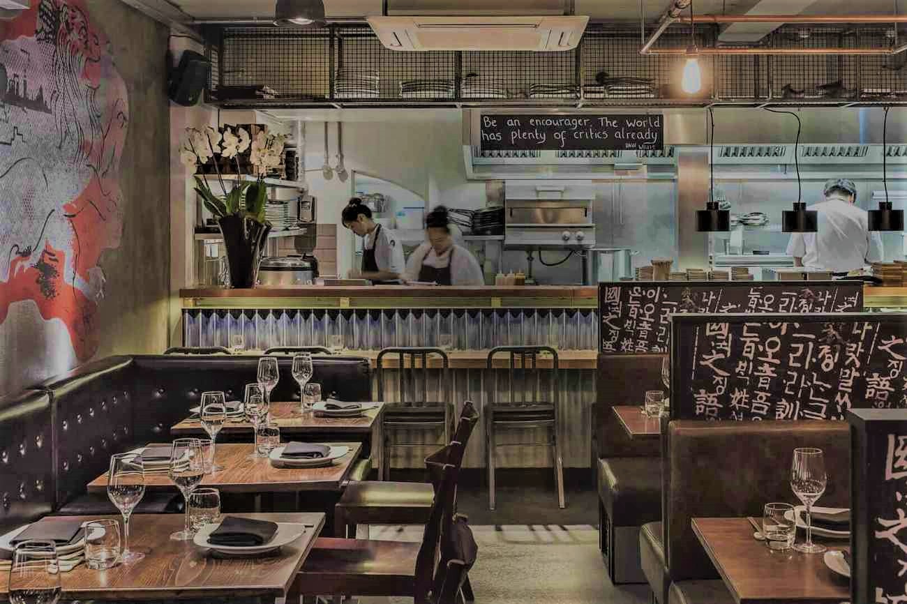 tables-and-kitchen-inside-jinjuu-restaurant