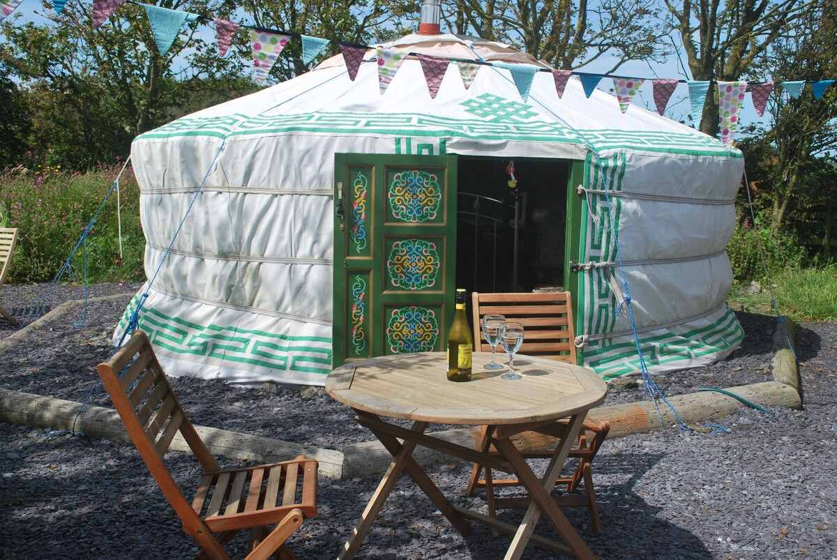 exterior-of-rhoscolyn-yurt-with-outdoor-furniture