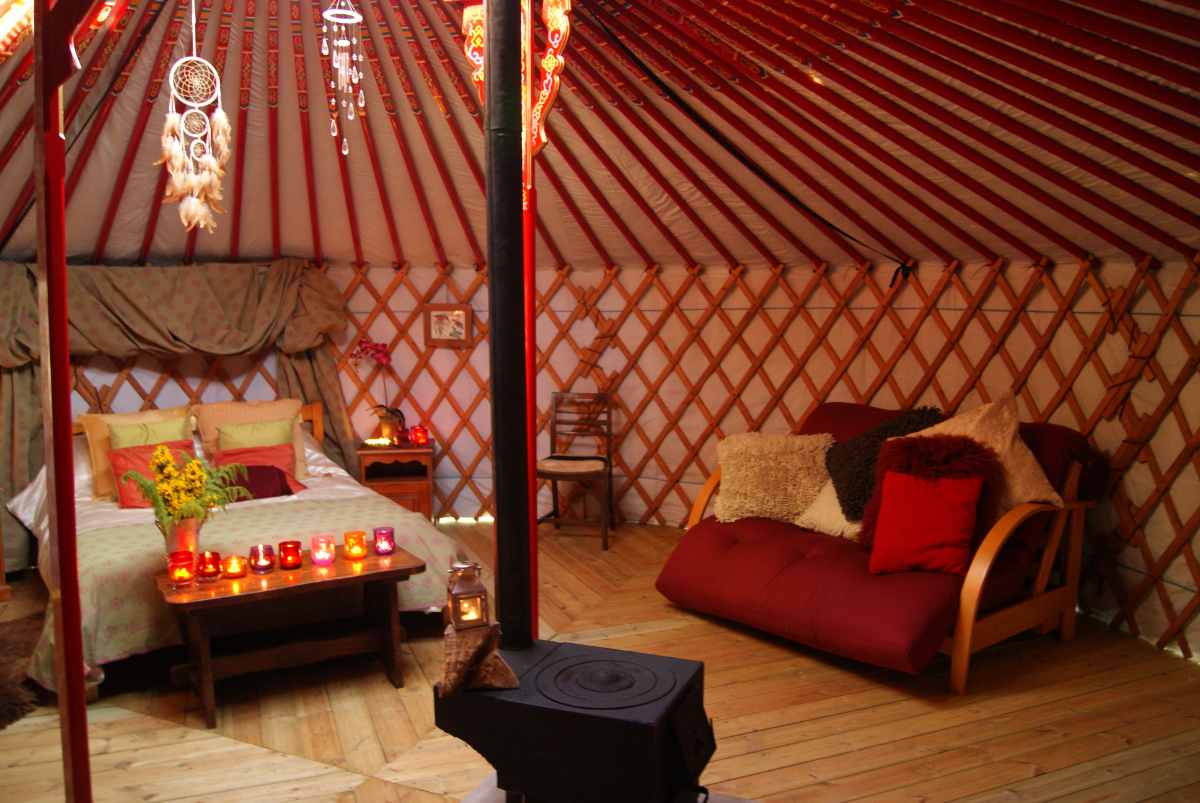interior-of-cae-wennol-yurt-with-bed-and-sofa