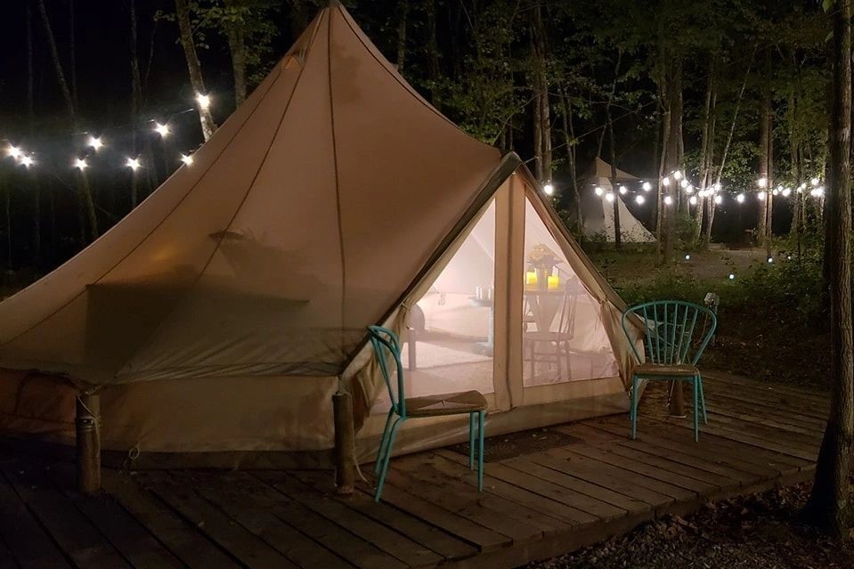 the-blue-bell-tent-lit-up-at-night-at-sassy-springs-retreat