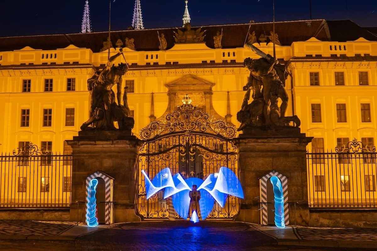 person-in-front-of-palace-on-light-painting-tour-things-to-do-in-prague-at-night