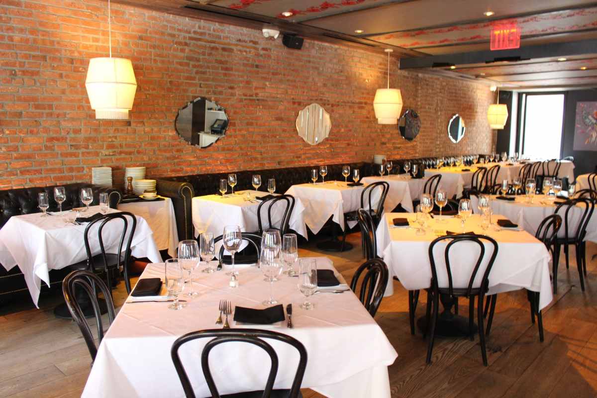 restaurant-tables-by-brick-wall-inside-bocca-di-bacco