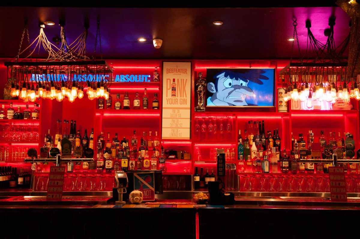 bar-at-asian-beer-cafe-lit-up-in-red