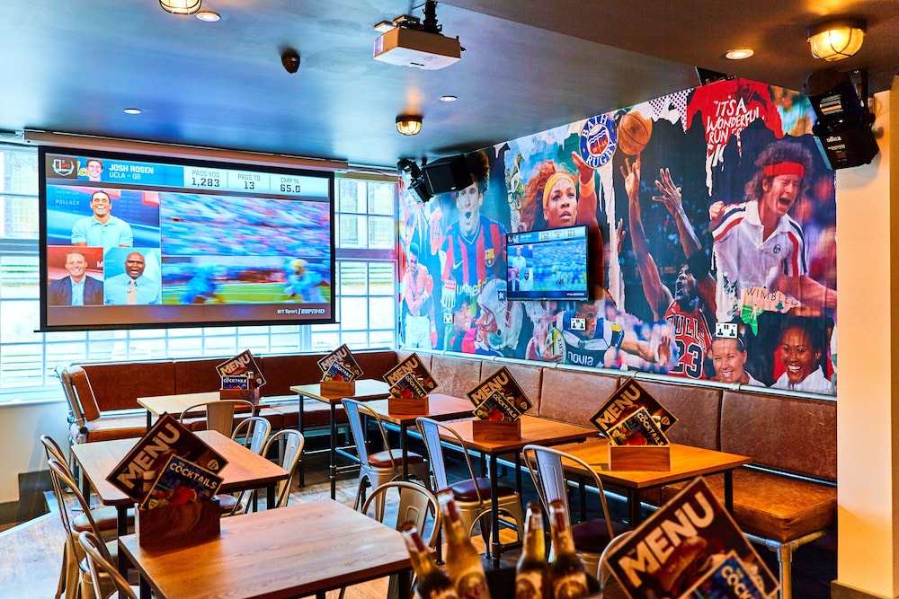 tables-and-tv-screens-inside-belushis-bar