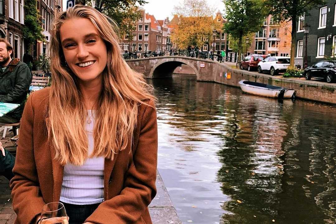 blonde-girl-sat-by-canal-in-amsterdam-kate-andrews