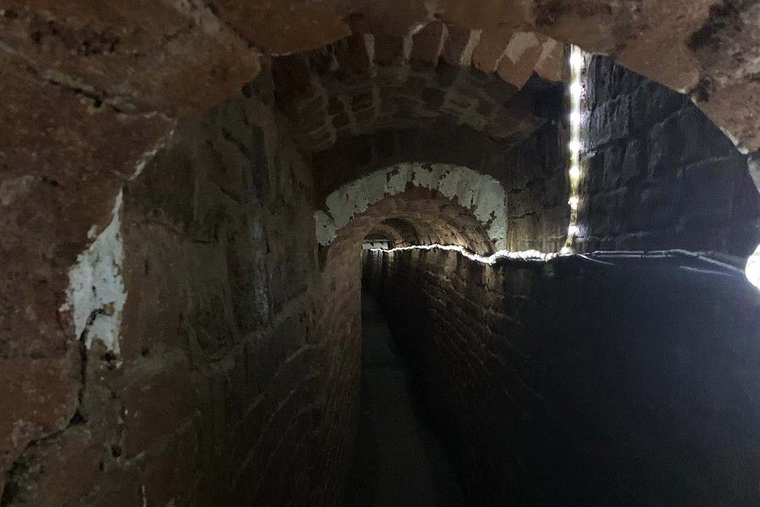 dark-underground-passages-with-light-strip-going-through