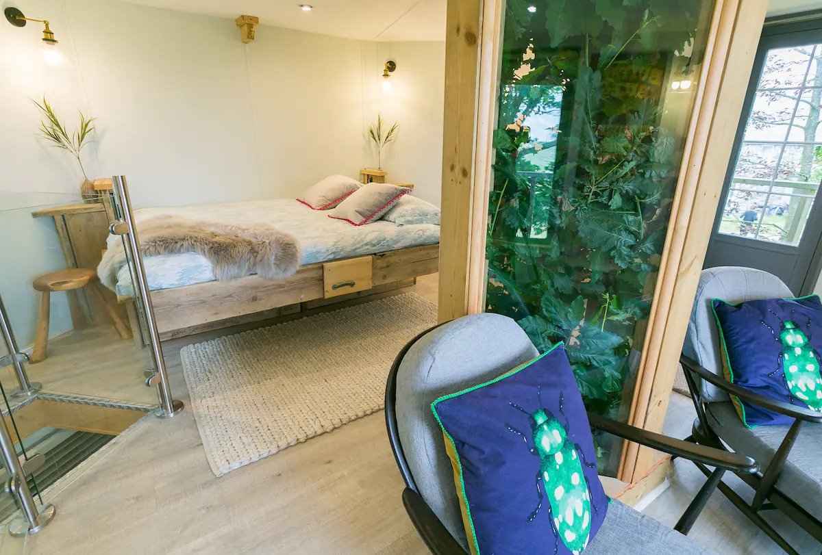 double-bed-and-seating-inside-treehouse